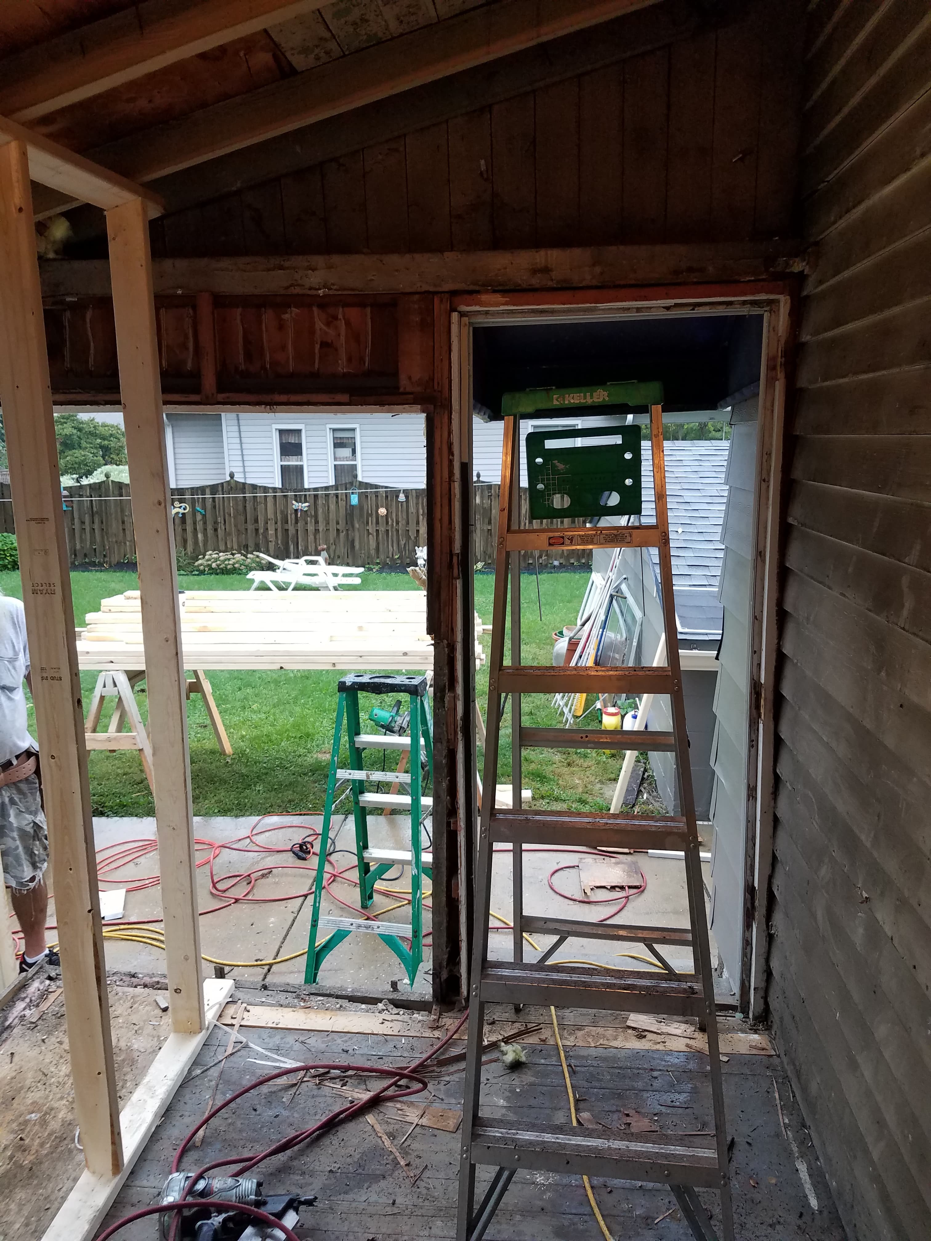 Removal of old entry door and prep for standard size door